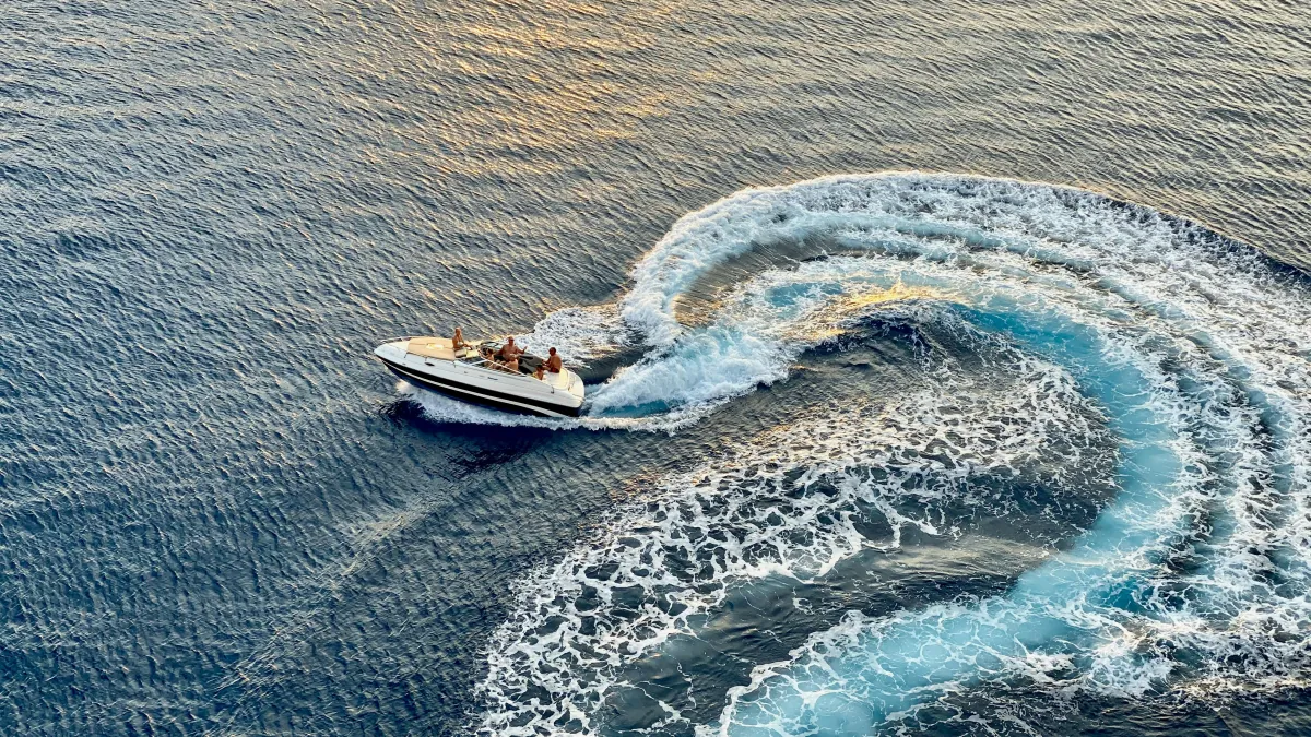 Speedboat turning on clear Mediterranean water